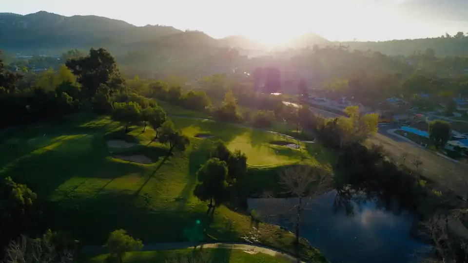 Golf course in a valley at sunrise